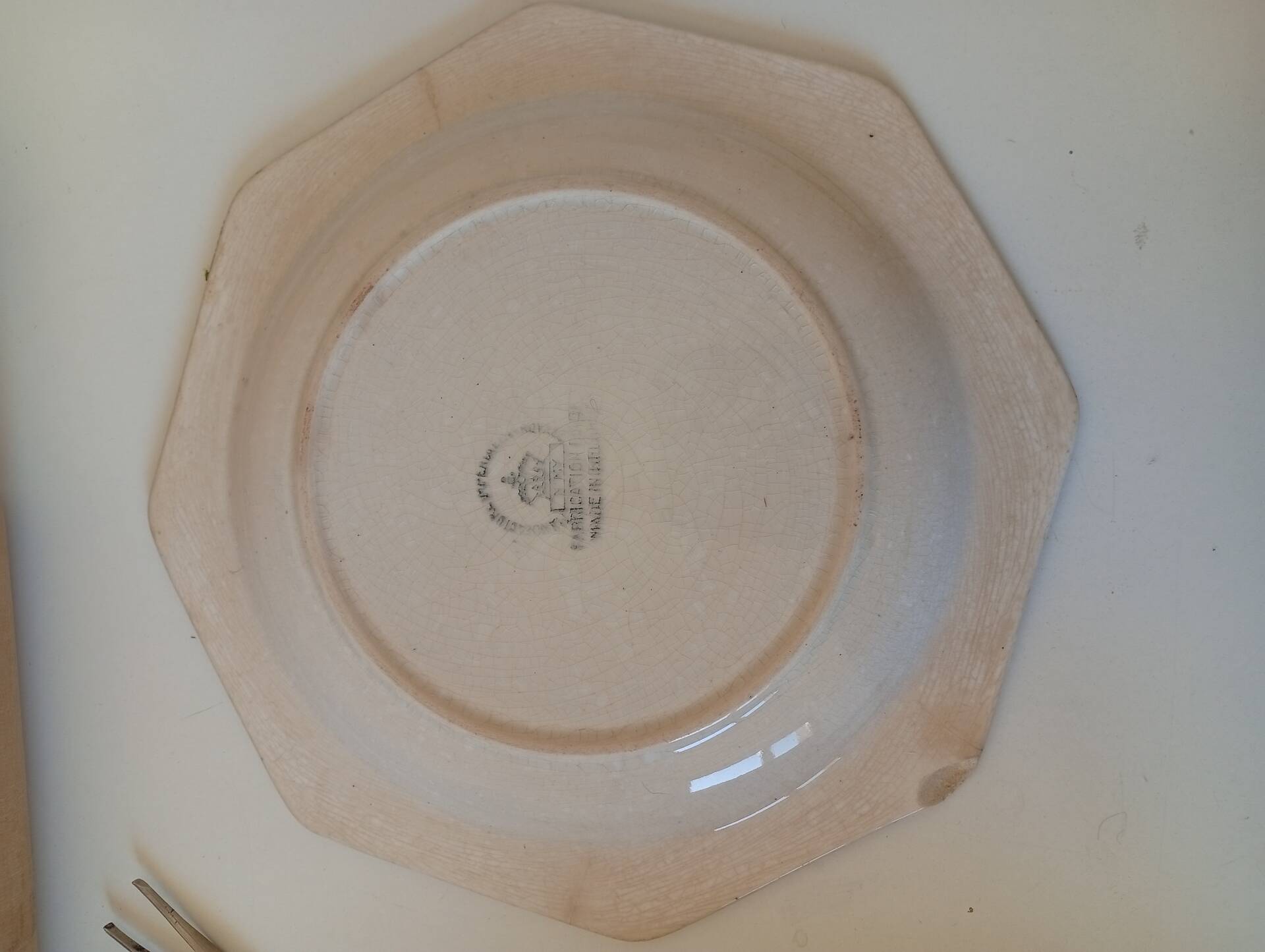 Octagonal blue dessert plate from the late 19th century in earthenware.
