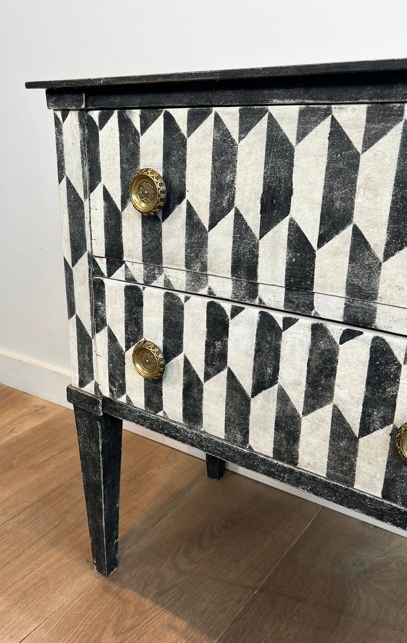 Small Italian chest of drawers with two drawers, patinated with a trompe-l'œil checkerboard pattern