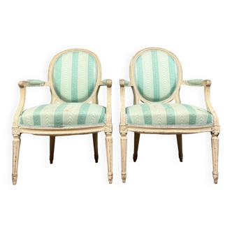 Pair of Louis XVI cabriolet armchairs in lacquered wood, 18th century