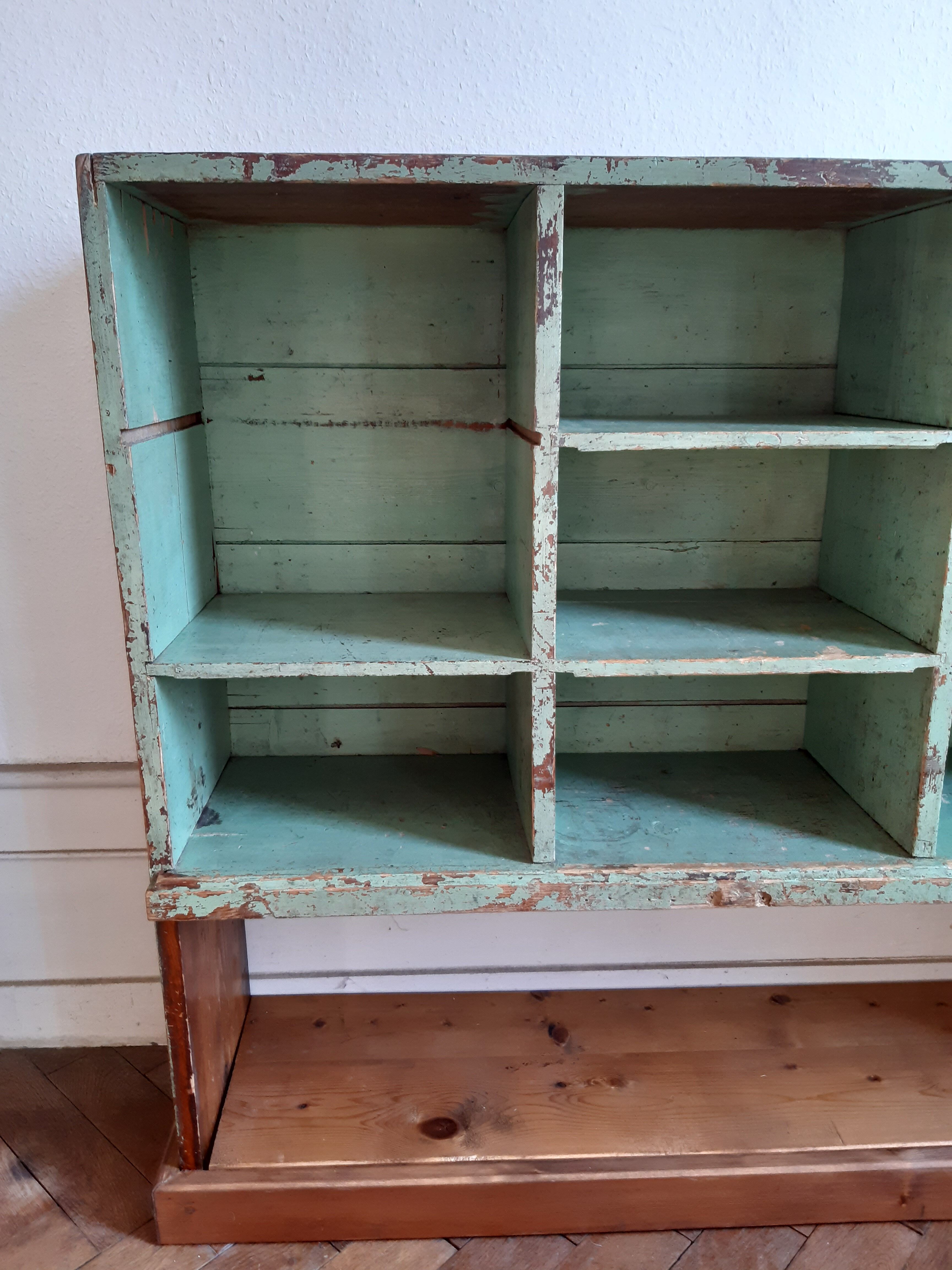 Old library shelf in patinated grocery tree