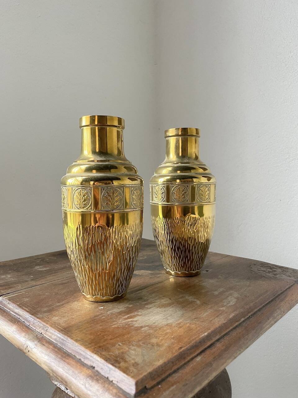 Duo of embossed brass vases