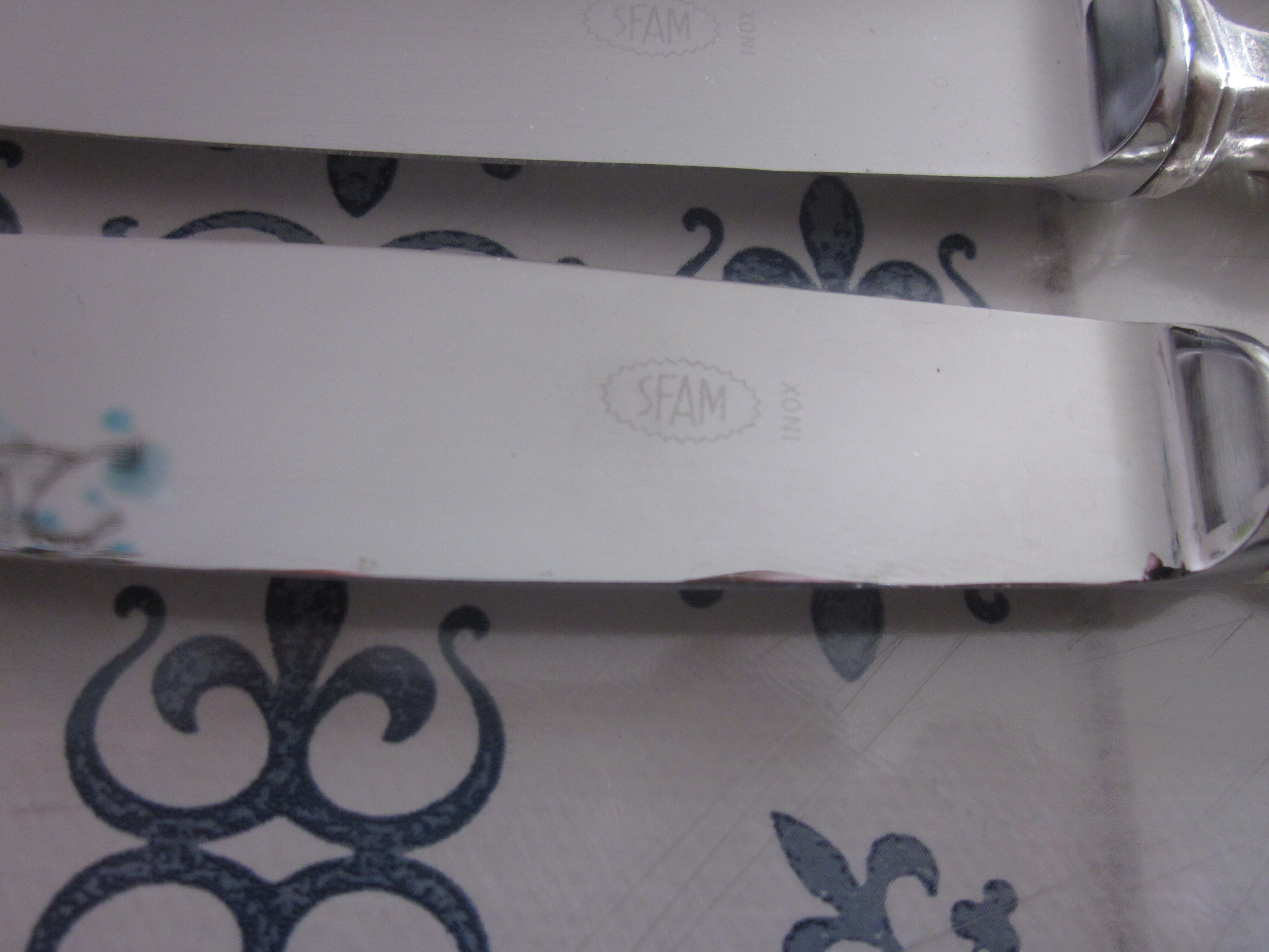 12 silver metal knives