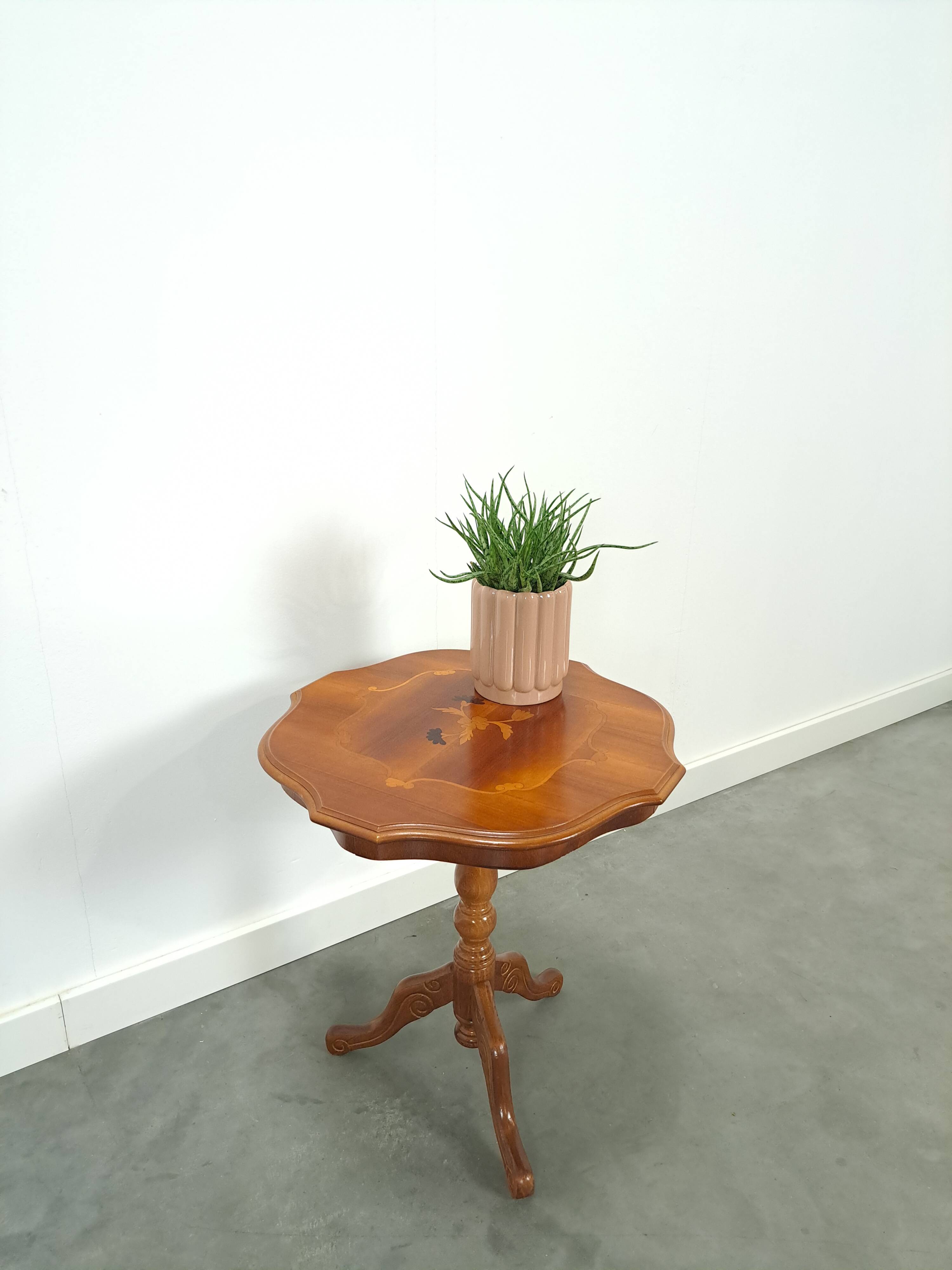 Round vintage wooden side table with inlaid veneer