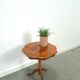 Round vintage wooden side table with inlaid veneer