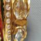 Swedish wall lamp in gold-colored metal with glass prisms. Estimated 1970-80s.