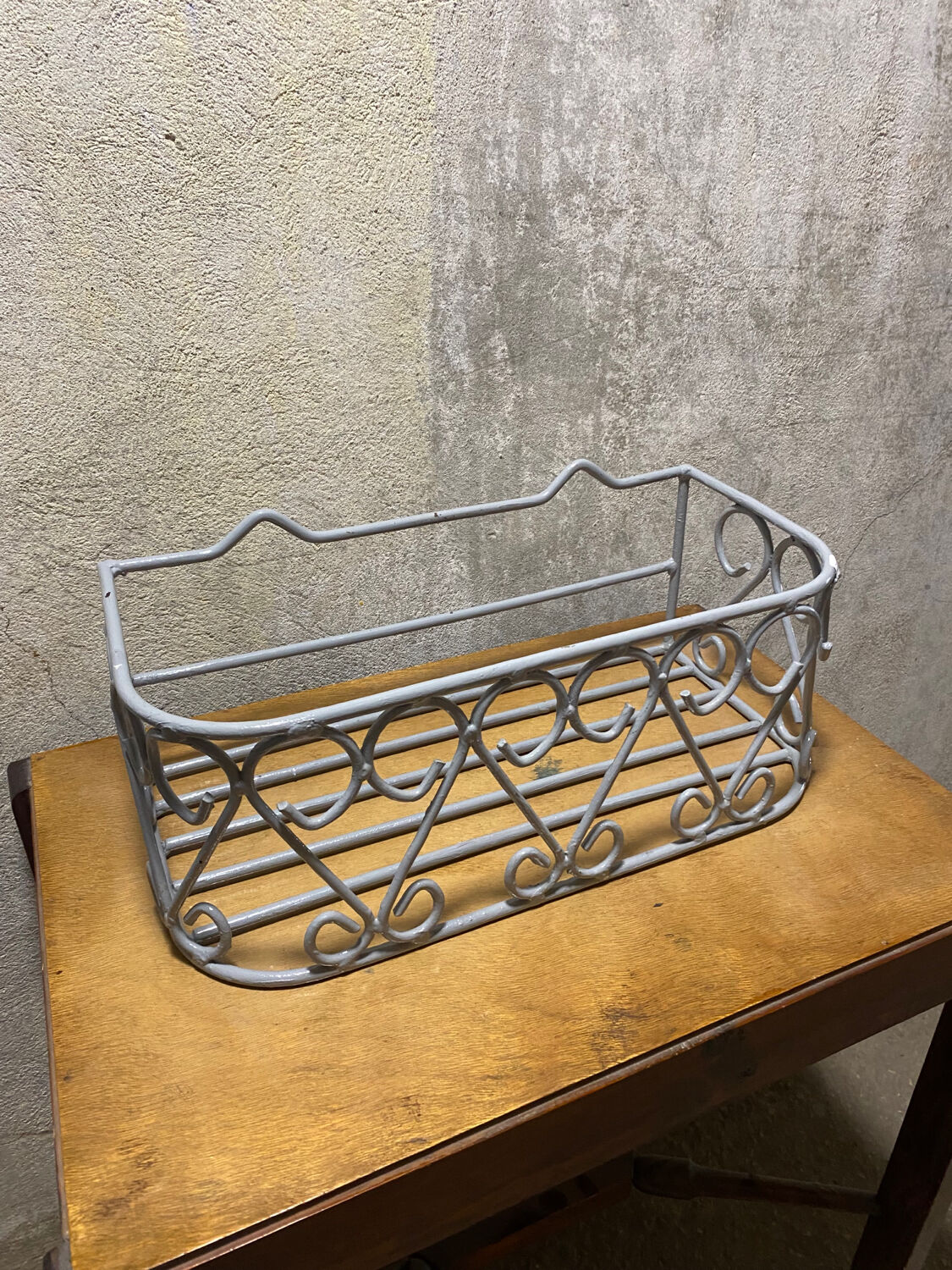 Gray wrought iron shelf