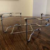 Chrome metal trivet by Tomado Holland