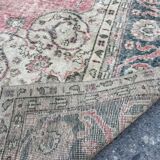 Pale pink rug with medallion