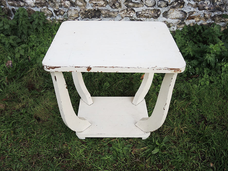 Old white wooden peestal table in art deco style