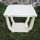 Old white wooden peestal table in art deco style