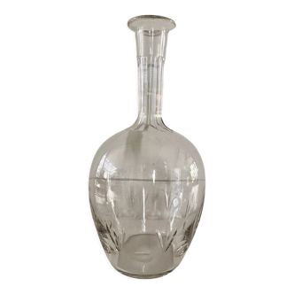 Old carafe in chiseled glass