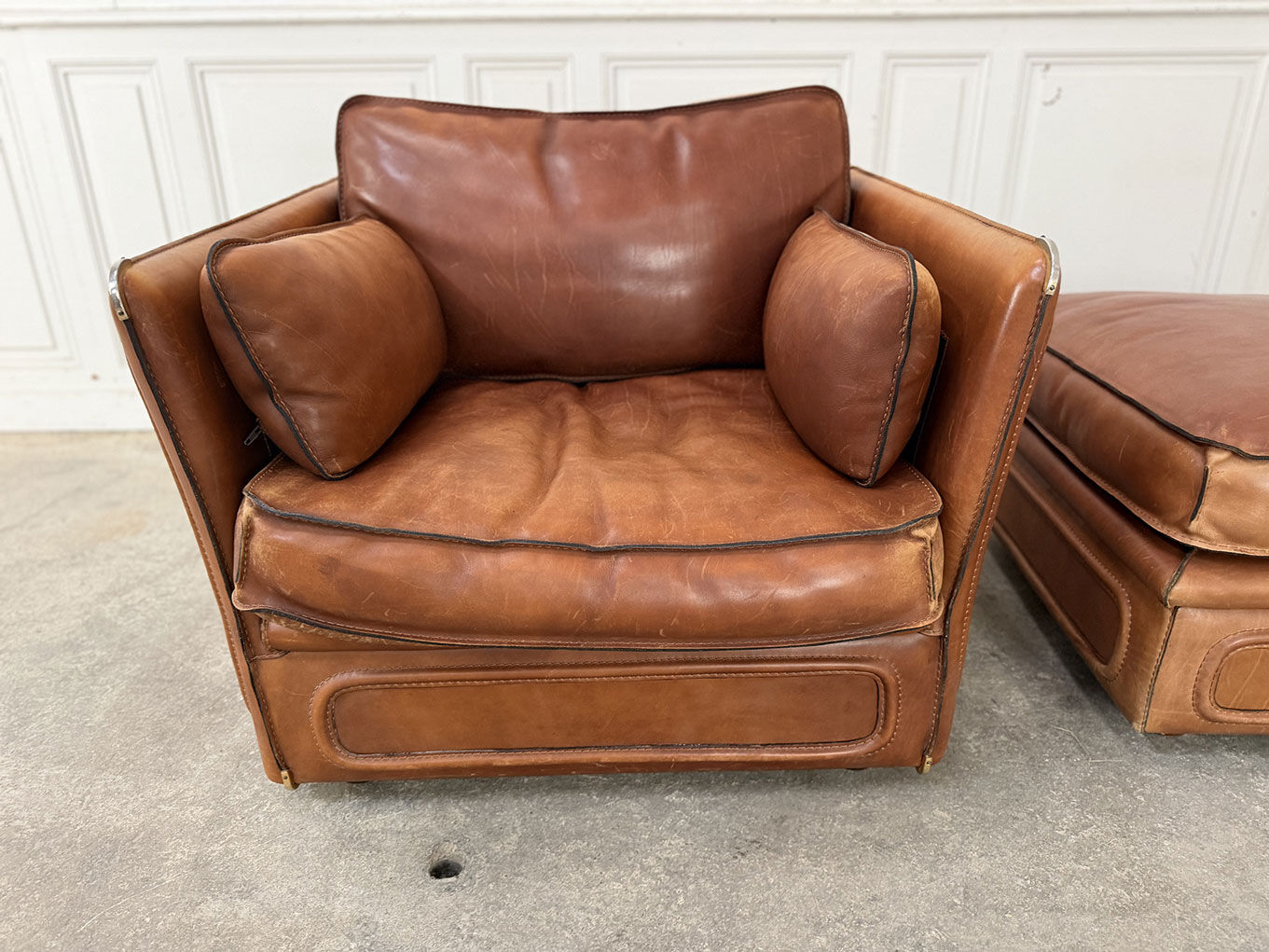 Club armchair and its ottoman 1980s