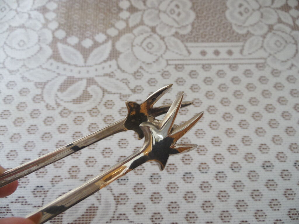 Silver-plated crow's feet claw