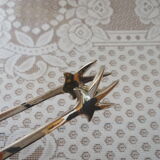 Silver-plated crow's feet claw