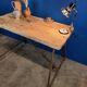 Vintage workbench circa 1930, folding metal leg.