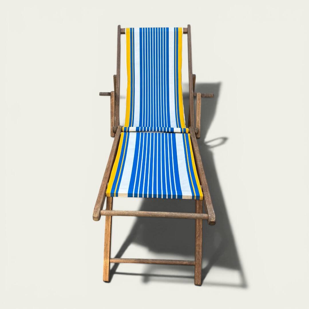 Vintage deck chair with blue and yellow striped fabric, original patina.