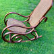 Rocking-chair en bois courbé et cannage
