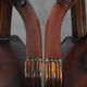 Set of two brown leather Chesterfield dining chairs in English style.