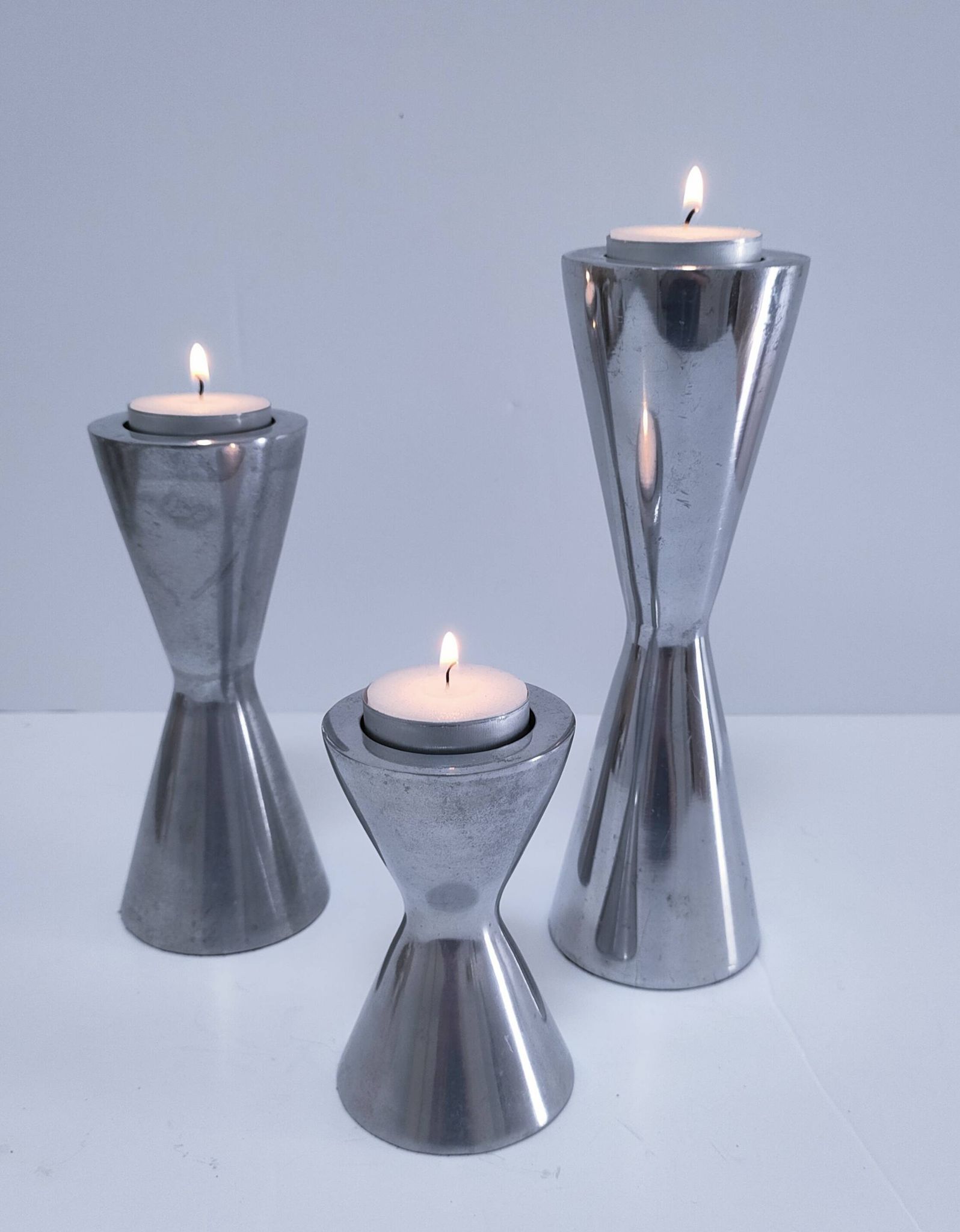three "diabolo" aluminium design candle holders 90