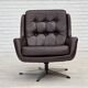 1970s, set of two swivel lounge chairs with footstool, leather.