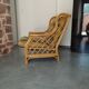 Vintage armchair in bamboo and rattan with a tartan pattern.