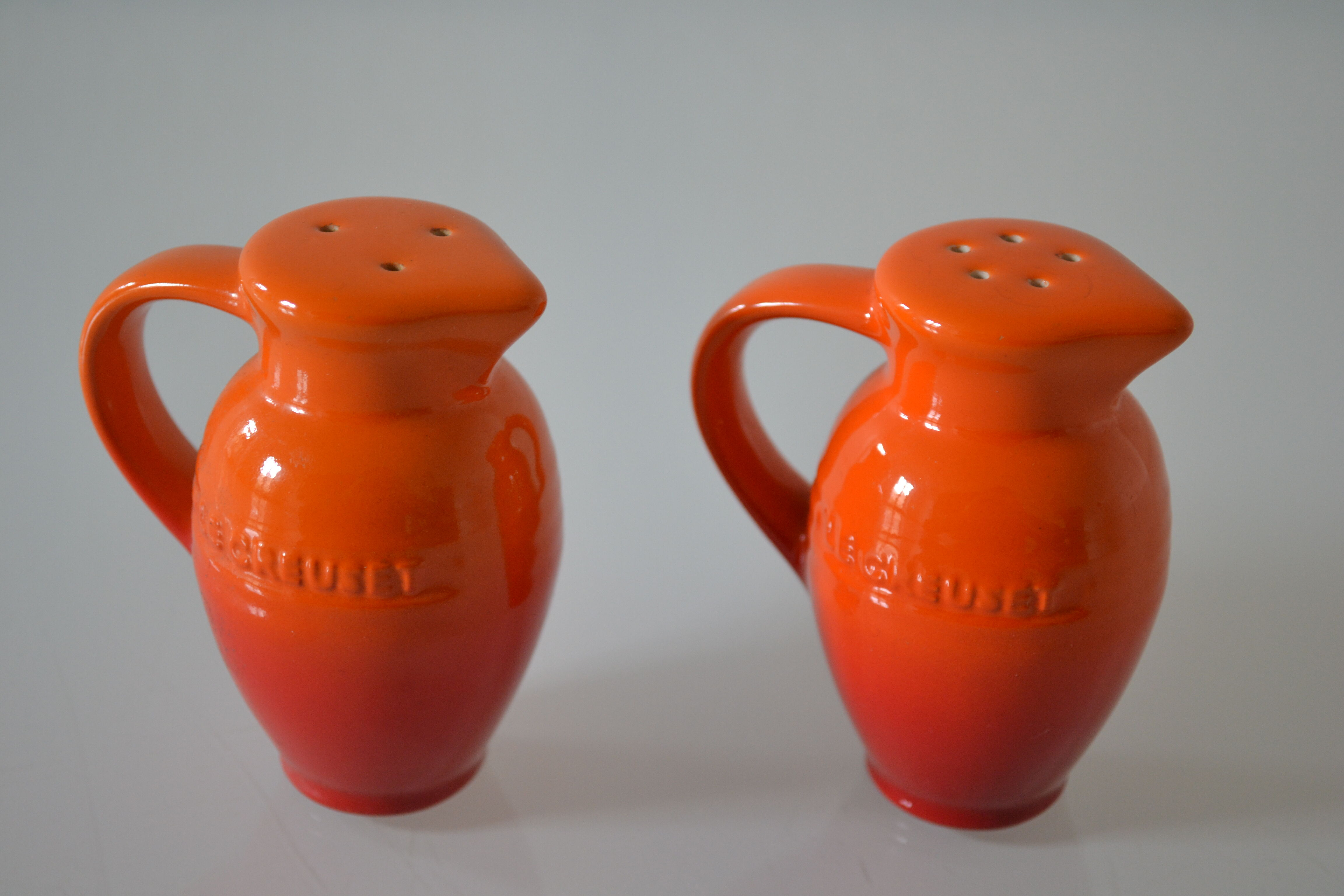 Le Creuset orange advertising salt and pepper