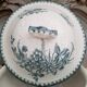 Old mismatched hollow plates in iron earth earthenware accompanied by a soup tureen