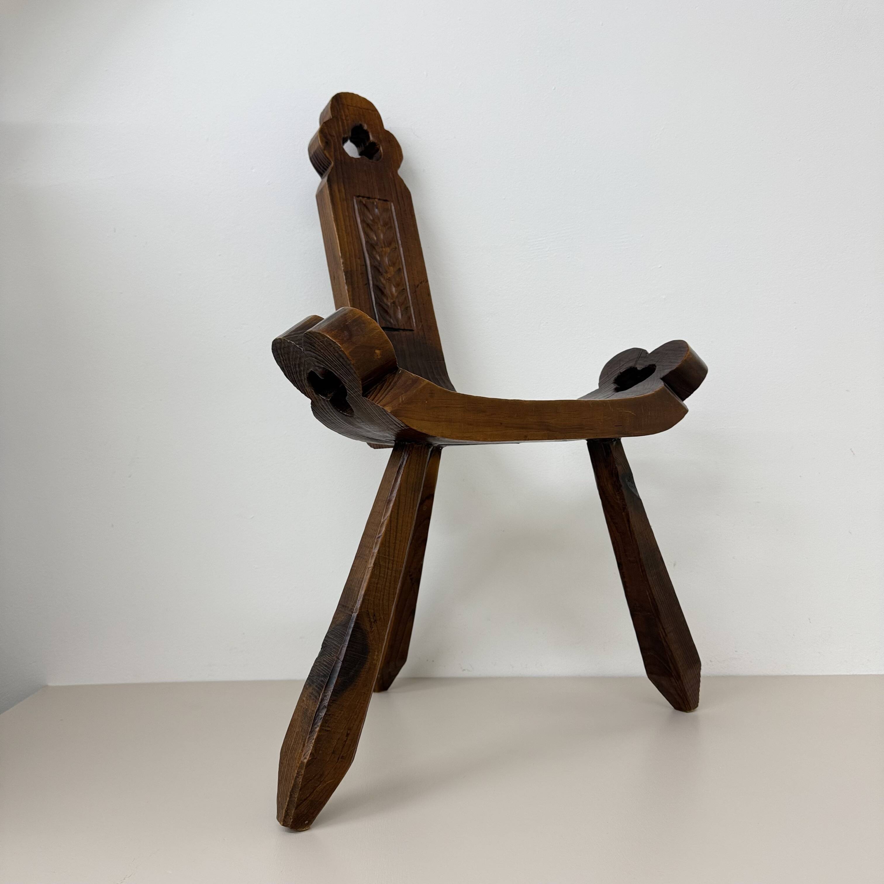 Brutalist hand carved oak Spanish tripod chair , 1970s