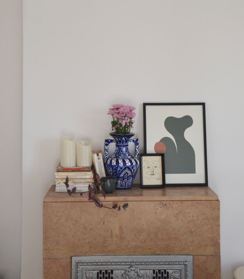 White hand-painted ceramic vase with blue patterns