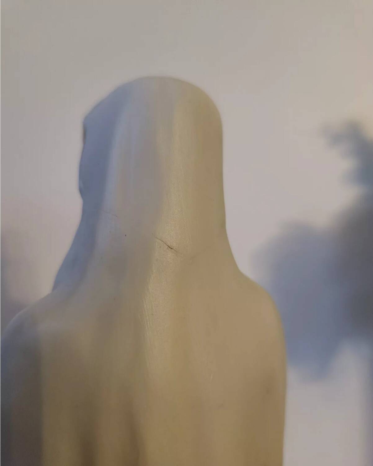 Religious statuette of the Virgin Mary in bisque porcelain