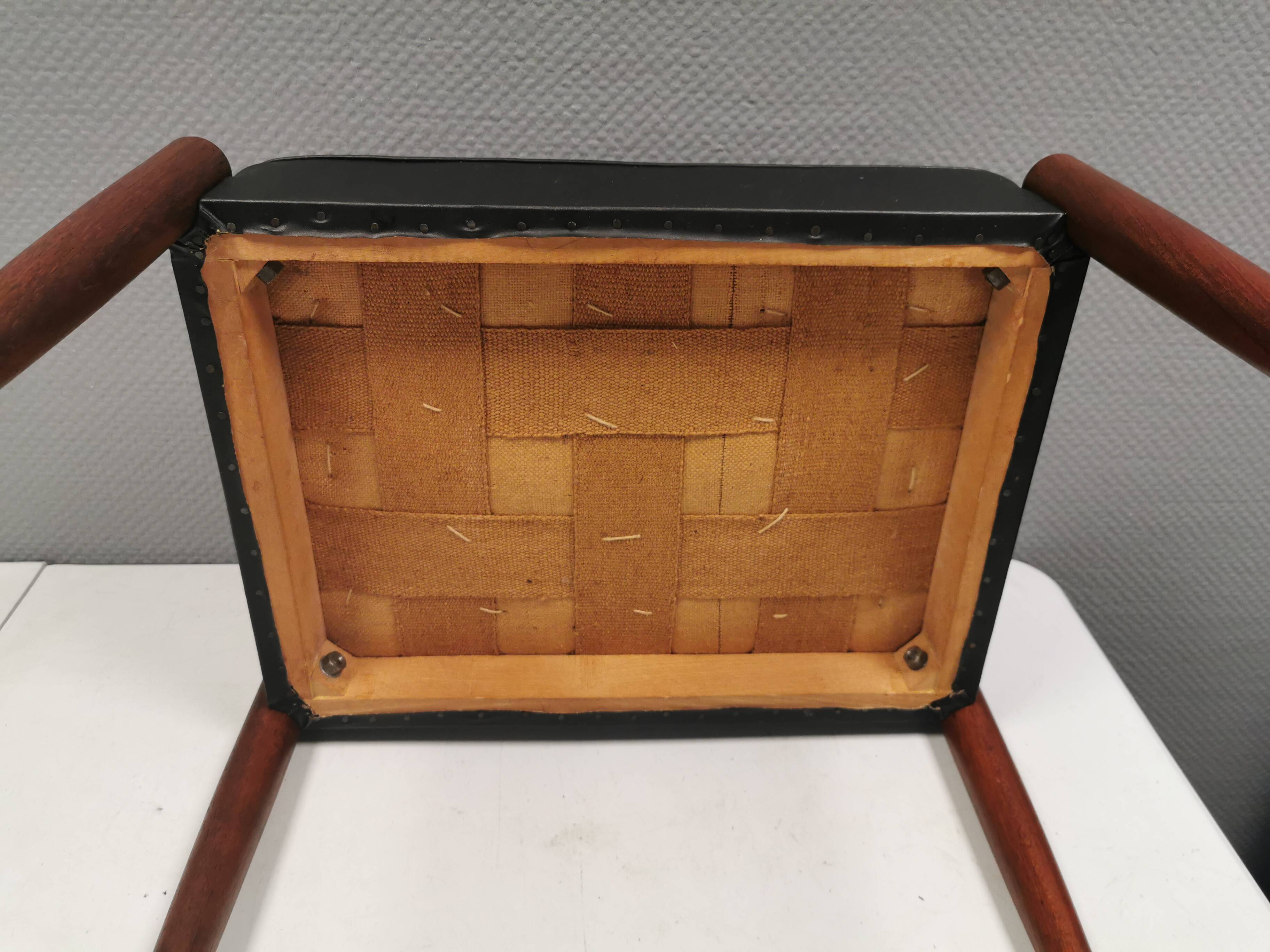 Footstool with teak wood legs and black skai (imitation leather) 1970s