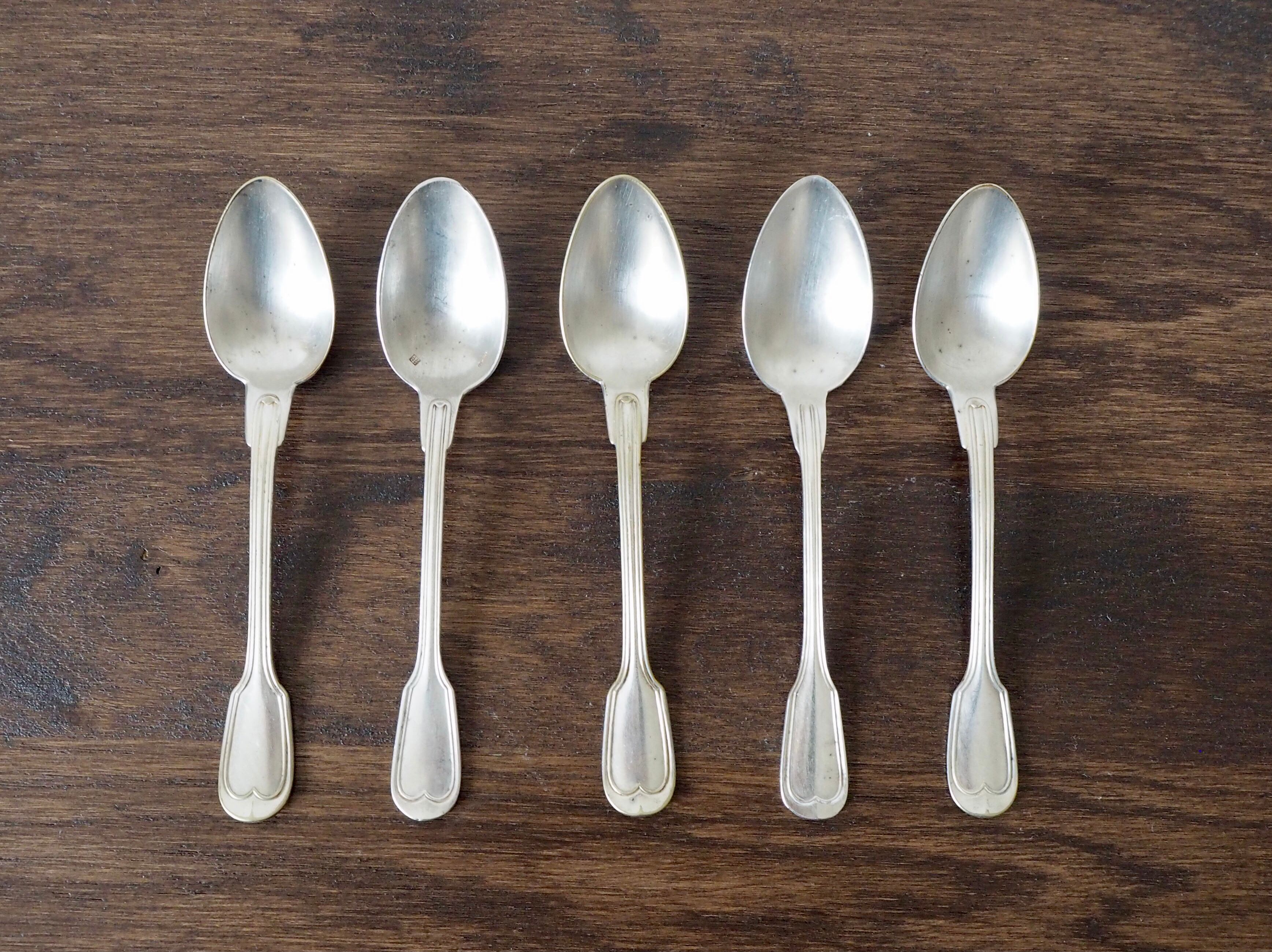Set of 5 white metal spoons from the 20s