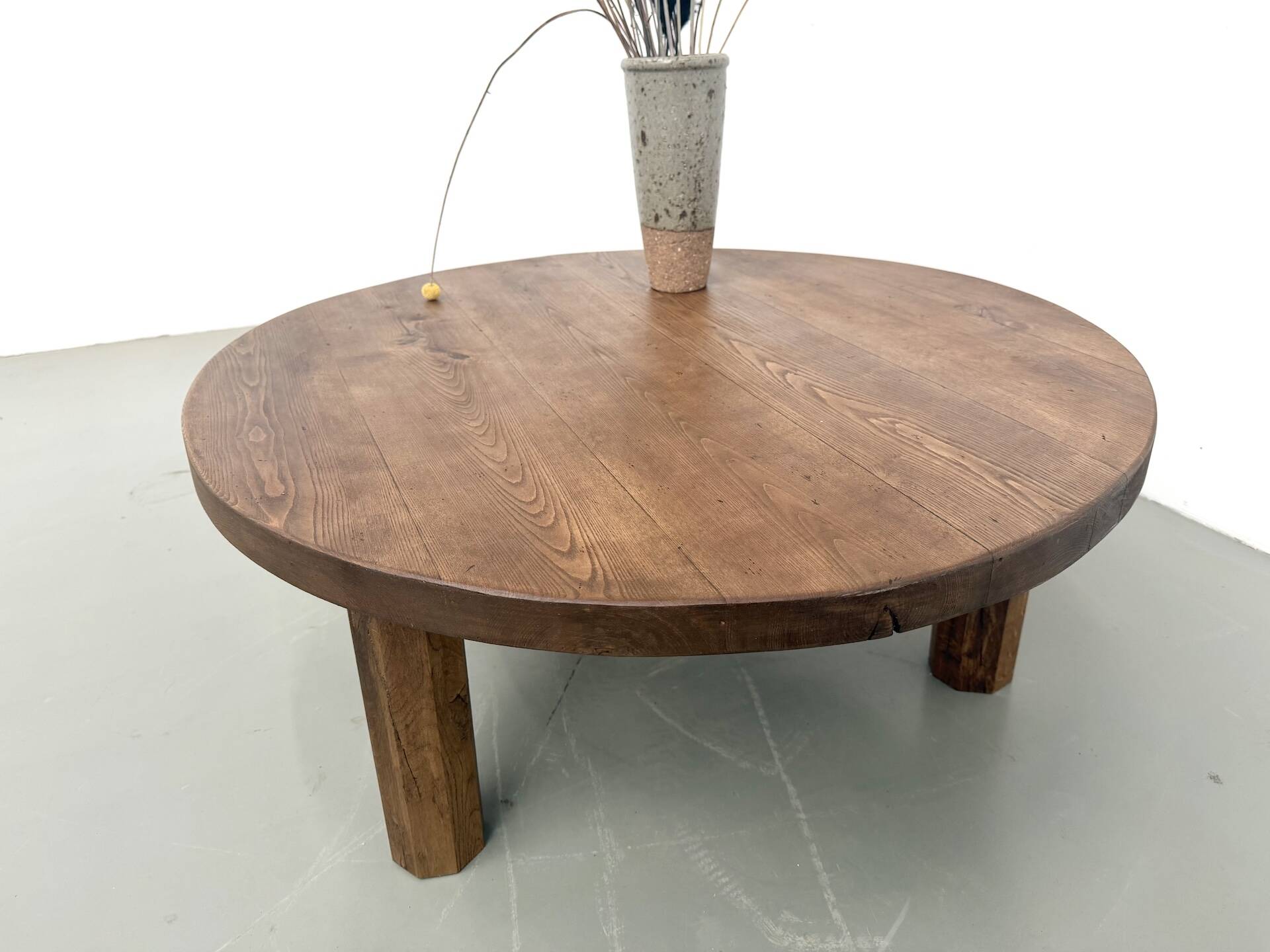 Round coffee table in solid oak, octagonal legs, France, 1950s.