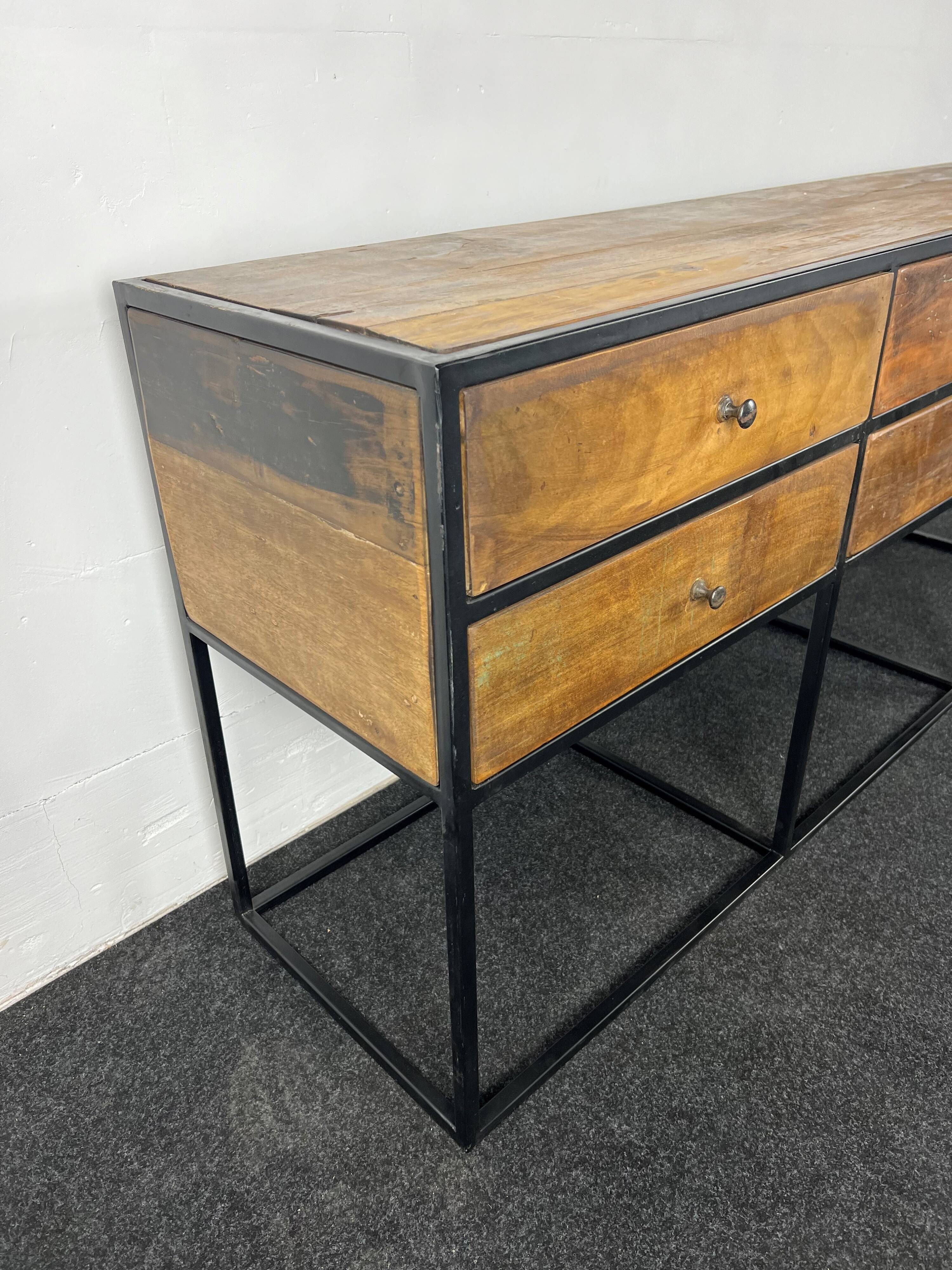 Antique wooden console with black metal base and 6 drawers