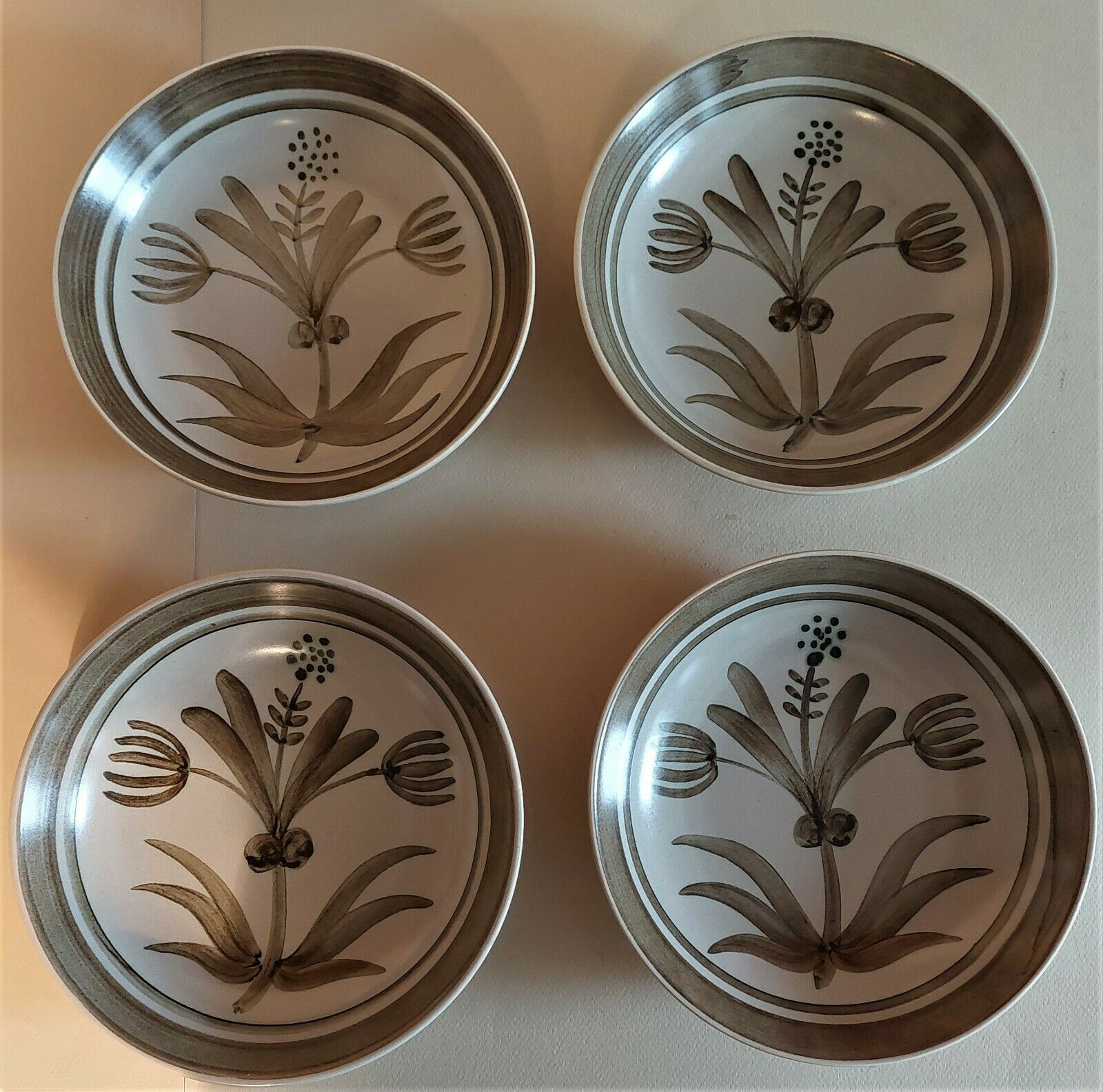 Vintage hollow plates in sandstone series of four marked Longchamp