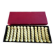 12 yellow and gold ceramic knife rests in their case from the 1950s.