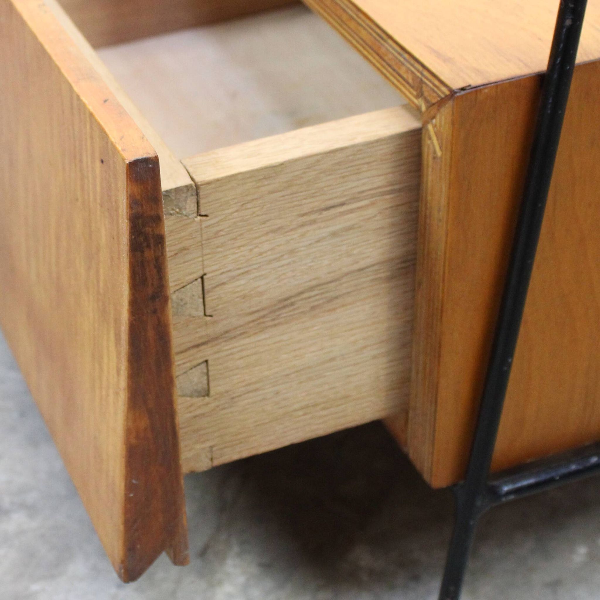 Vintage wood and lacquered metal storage unit.