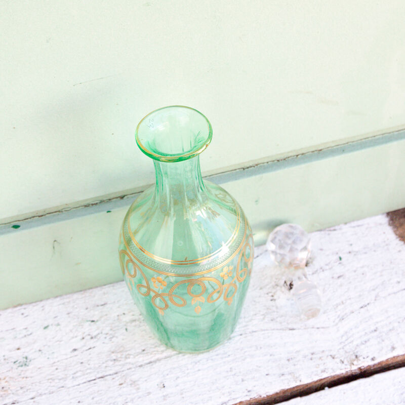 Green and gold flask numbered 23