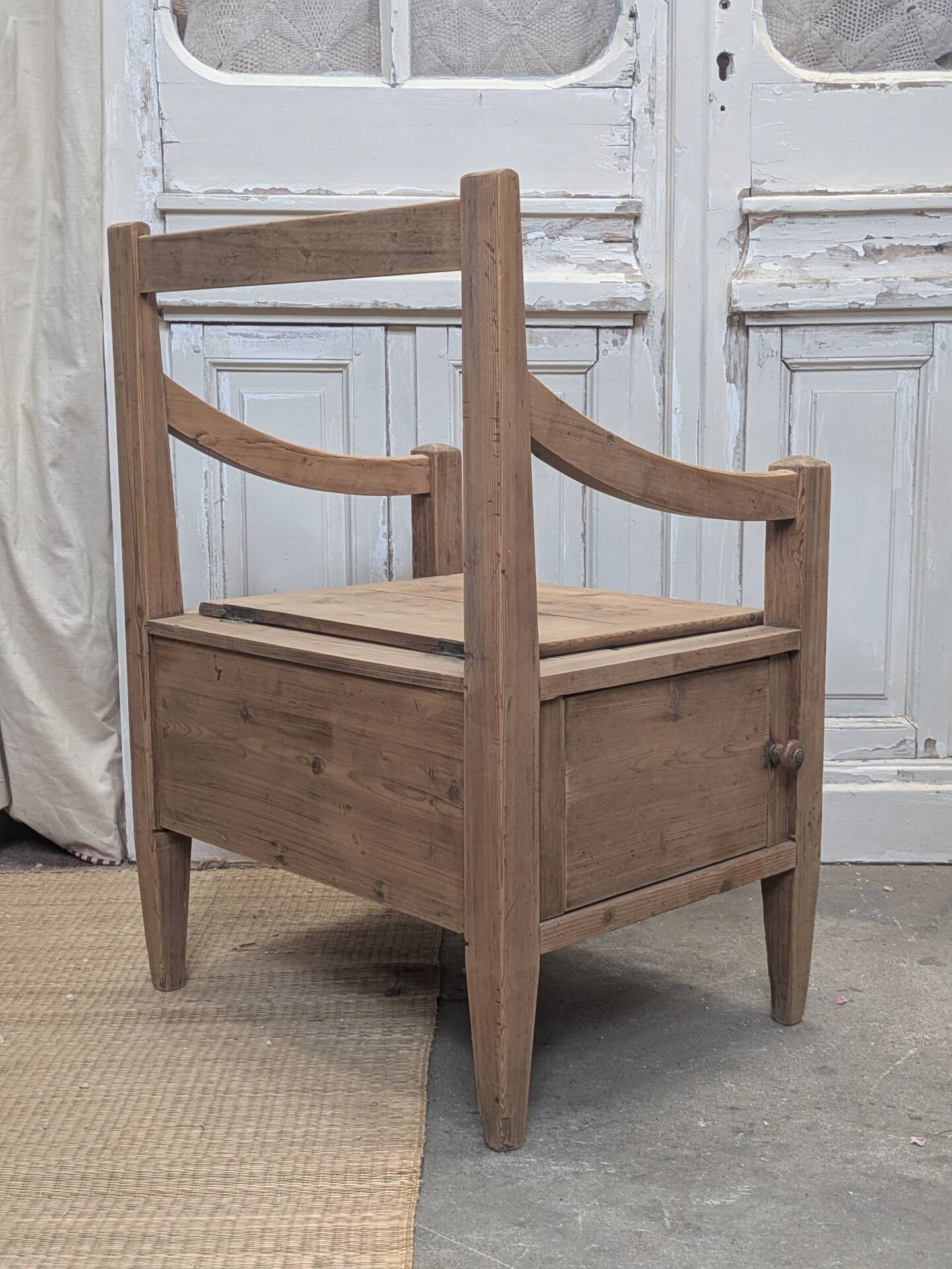 Antique armchair in raw wood