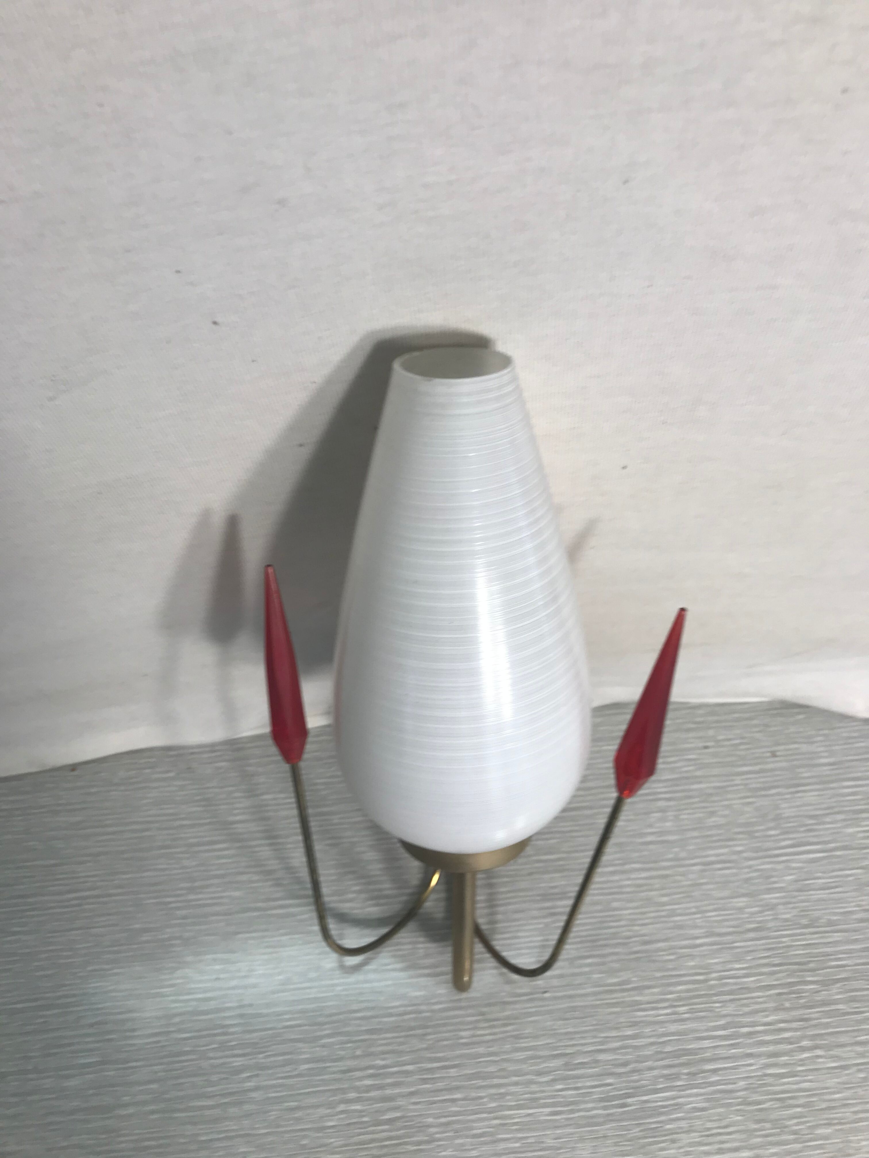 Golden metal wall sconce with red and white opaline reflectors