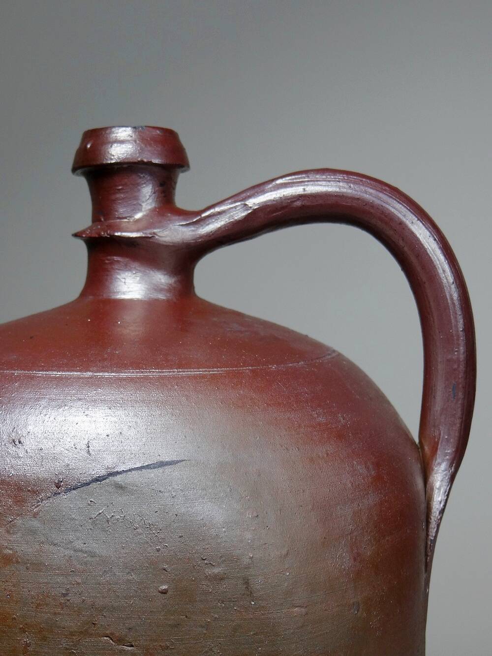 Large stoneware jar from Normandy with lustrous burgundy glaze, from the 1920s-30s.