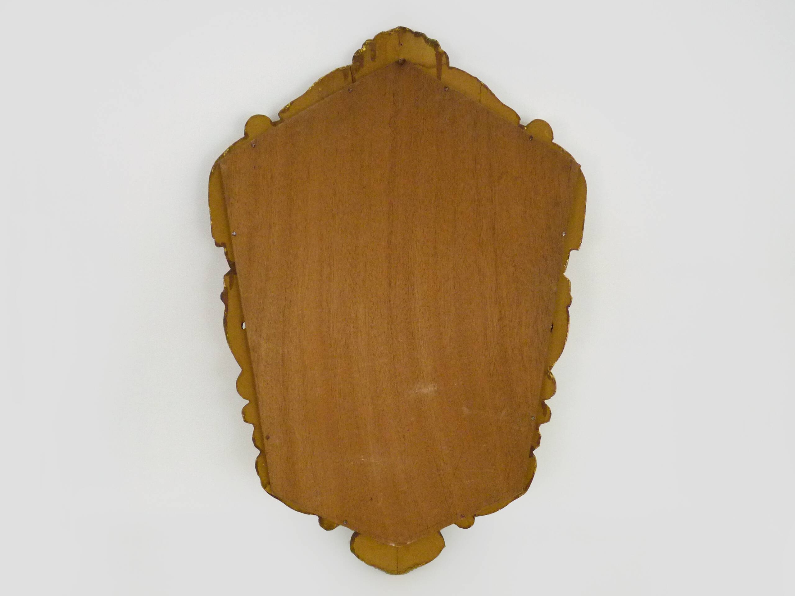 Old wall mirror in wood and gilded stucco with shell decoration, Louis XV style pediment mirror