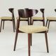 Green and walnut fabric dining chairs