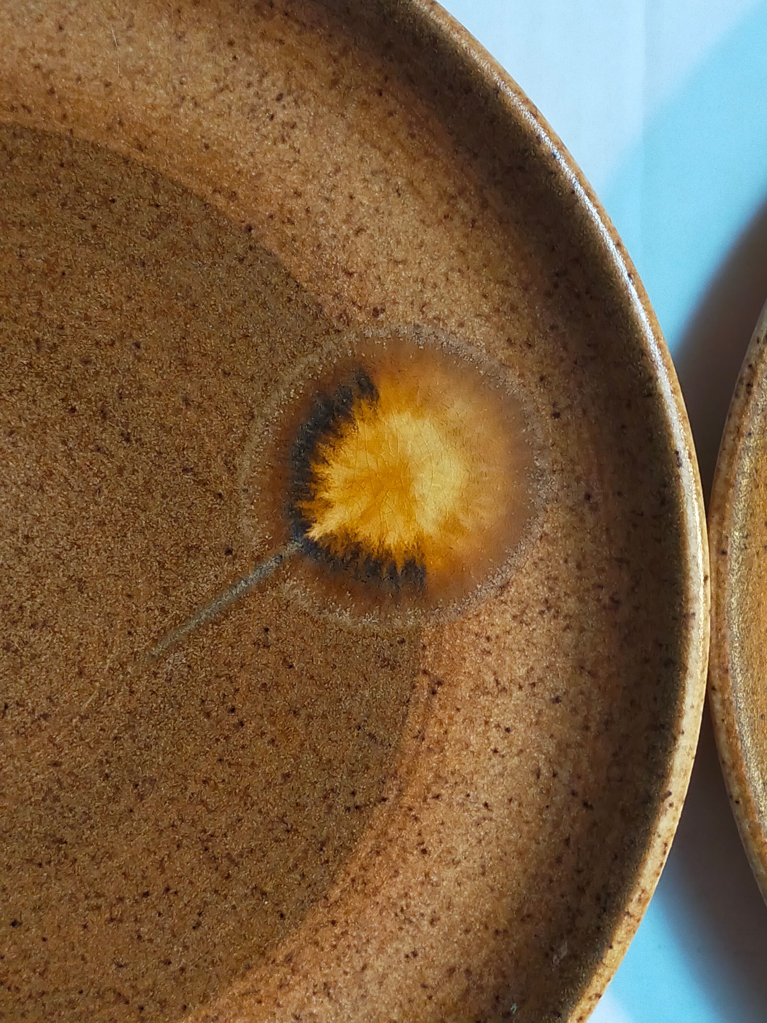 Four vintage glazed stoneware potter's plates