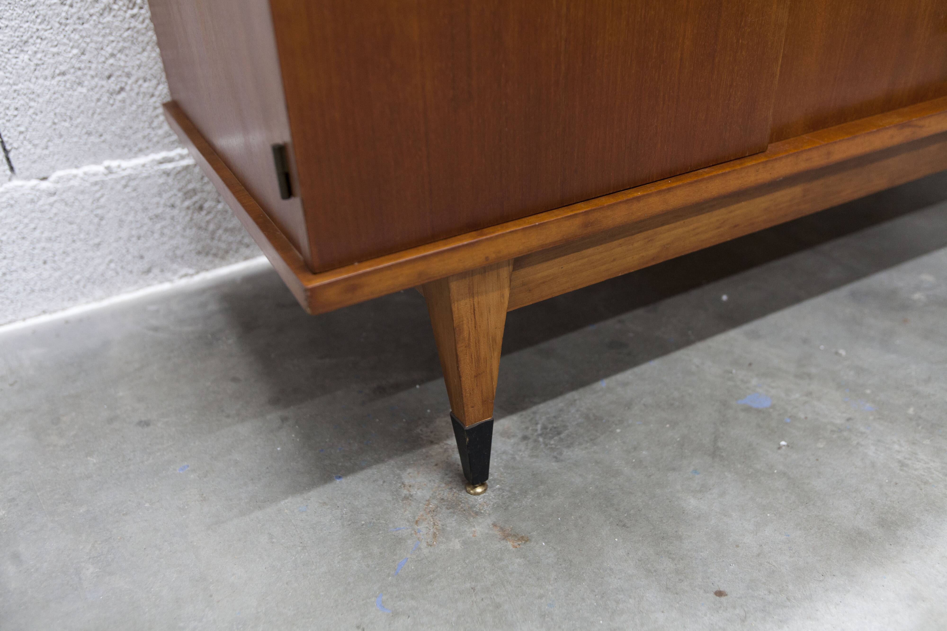 1960s teak sideboard with 4 drawers, 2 doors, and a mirror.