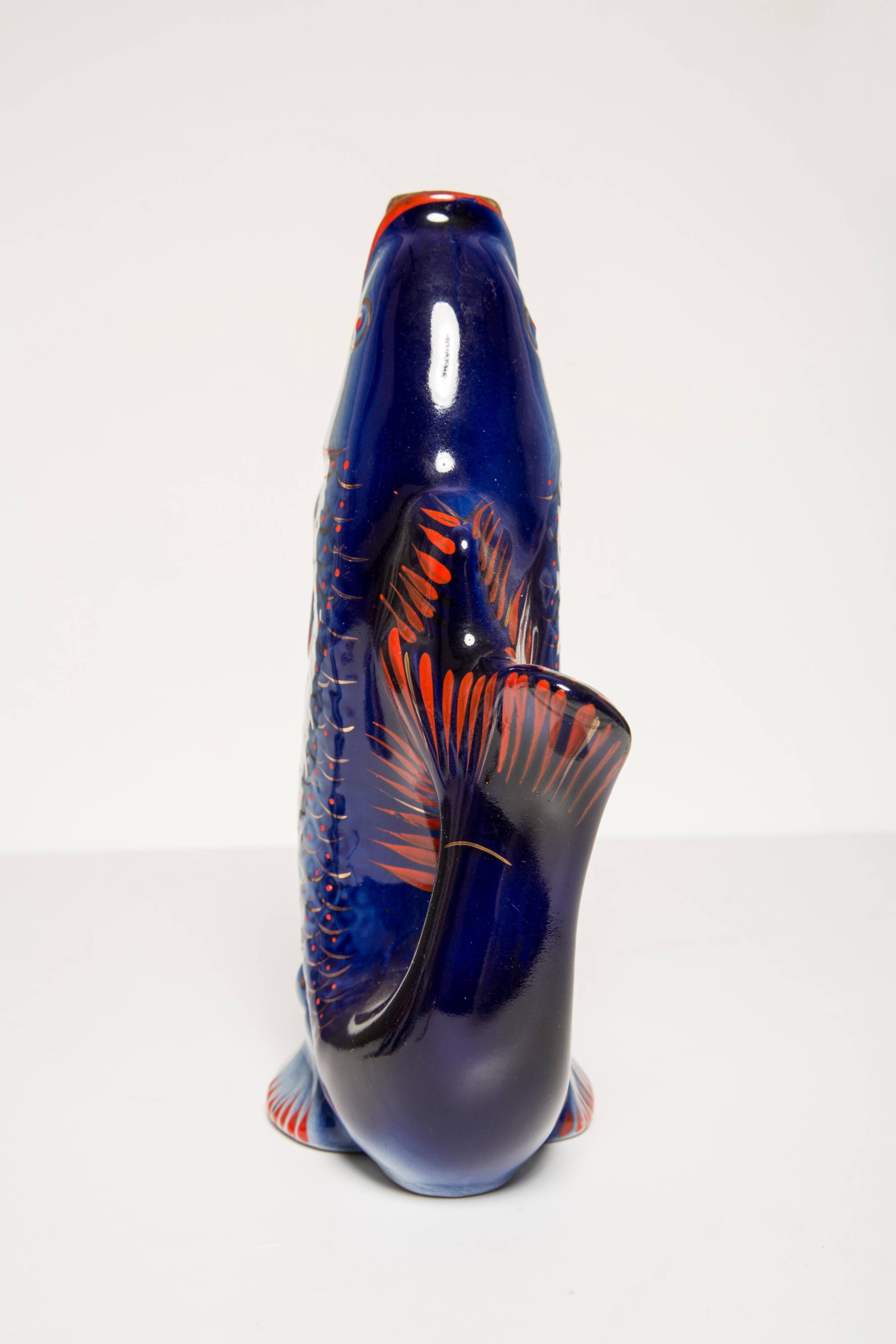 Set of 7 glasses and a glass carafe decorated with blue fish, Mid-Century Modern style, Europe, 1960s.