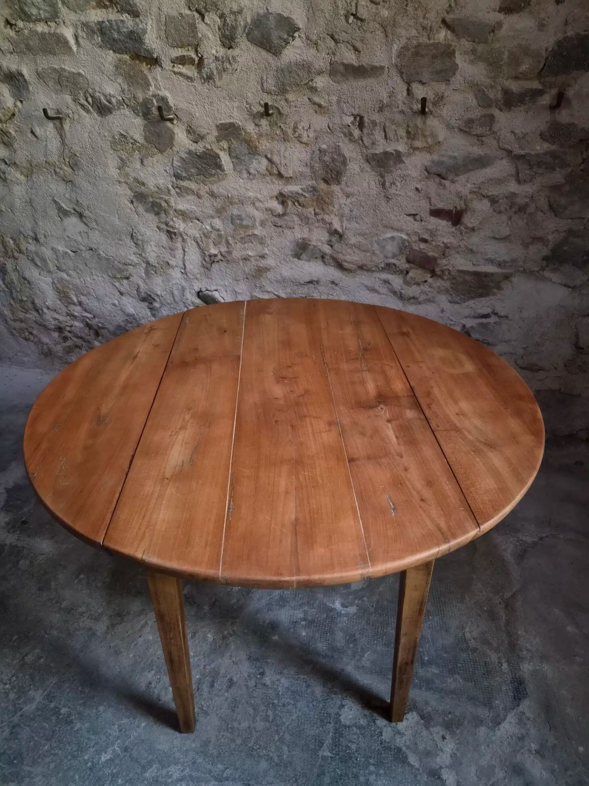 Rustic French antique dining table, drop-leaf table in cherry wood, circa 1900.