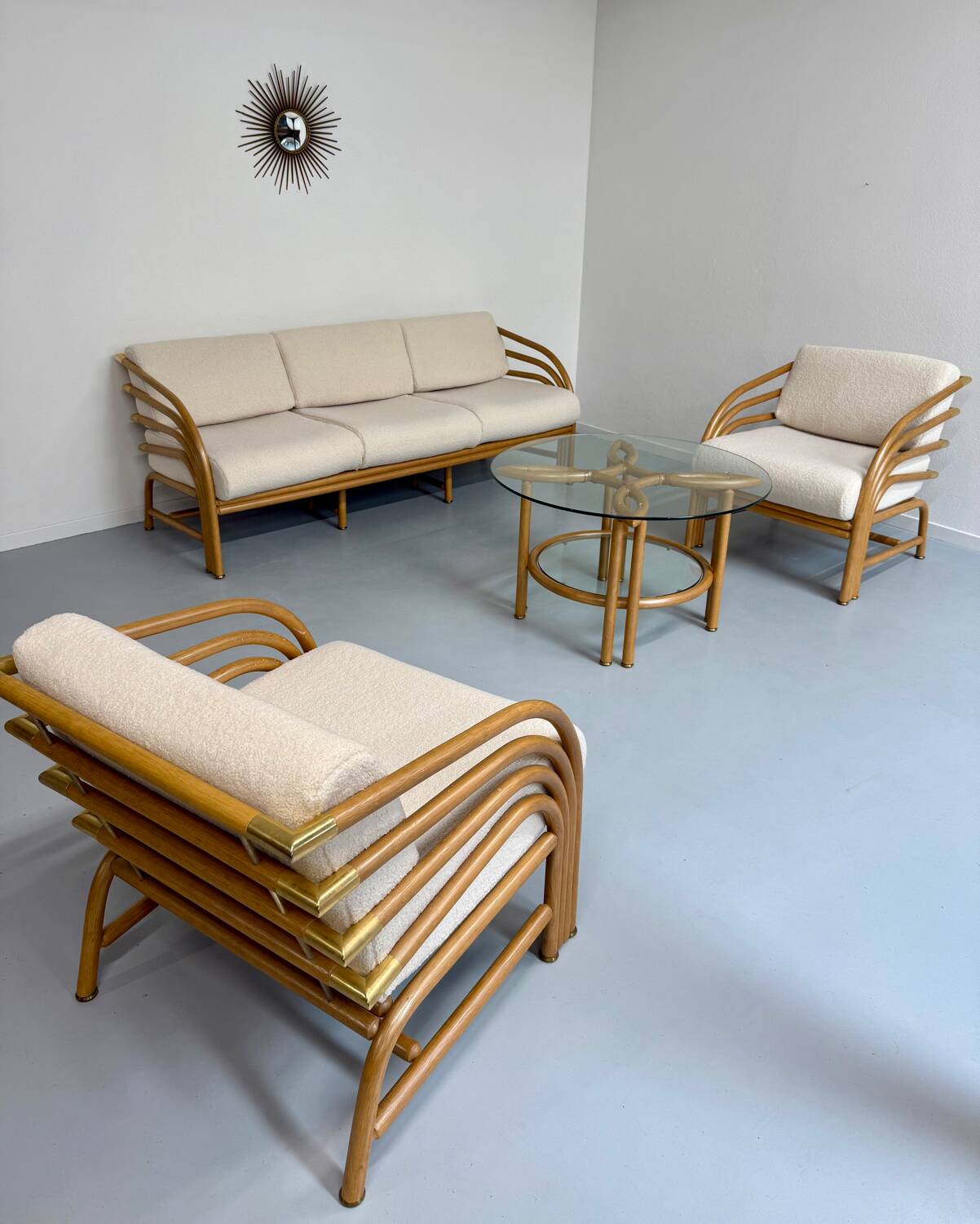 Complete living room with rattan sofa and white bouclette, brass finish, 80's design