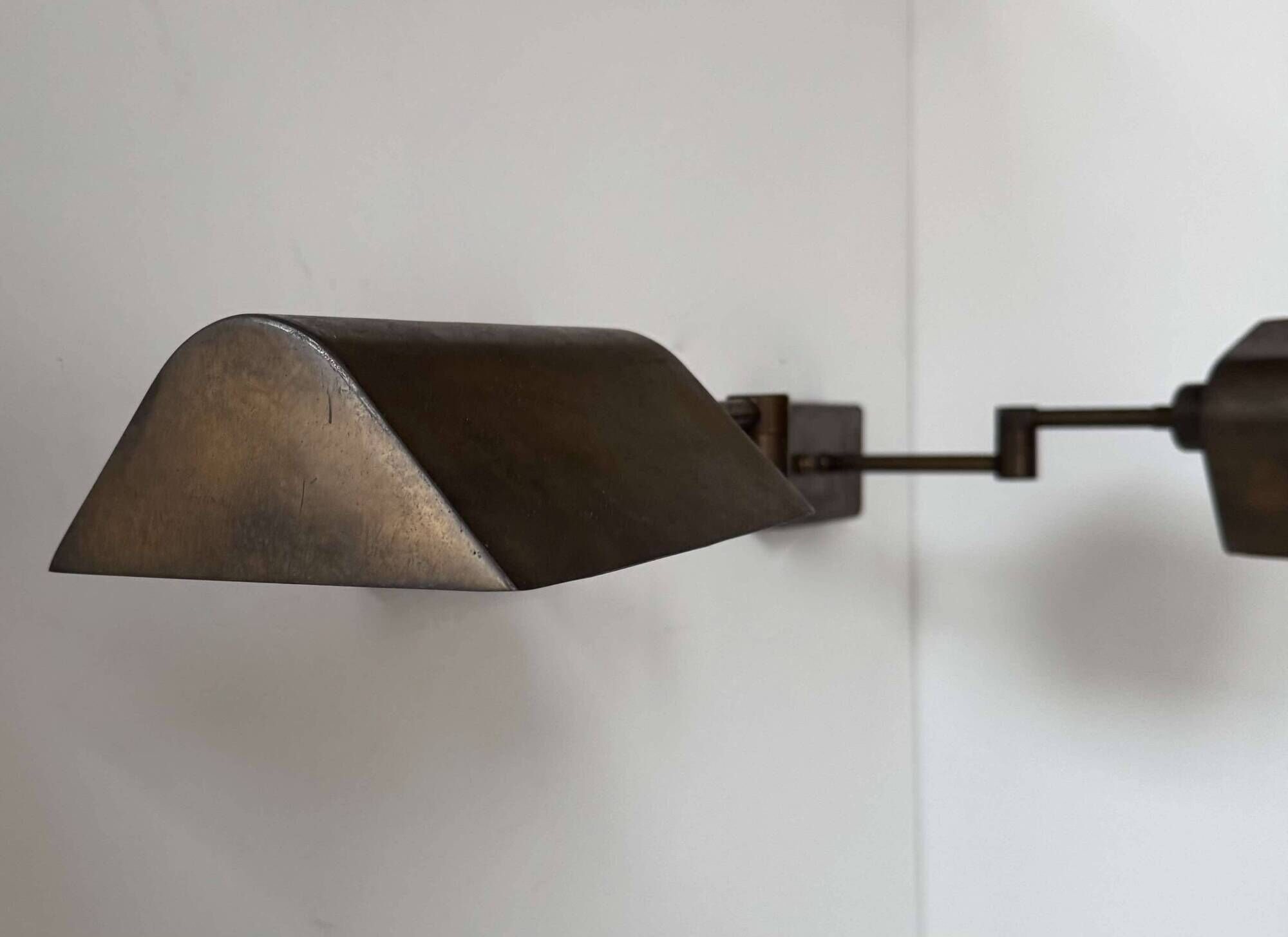 Pair of vintage adjustable wall lights, patinated brass, France 1970.