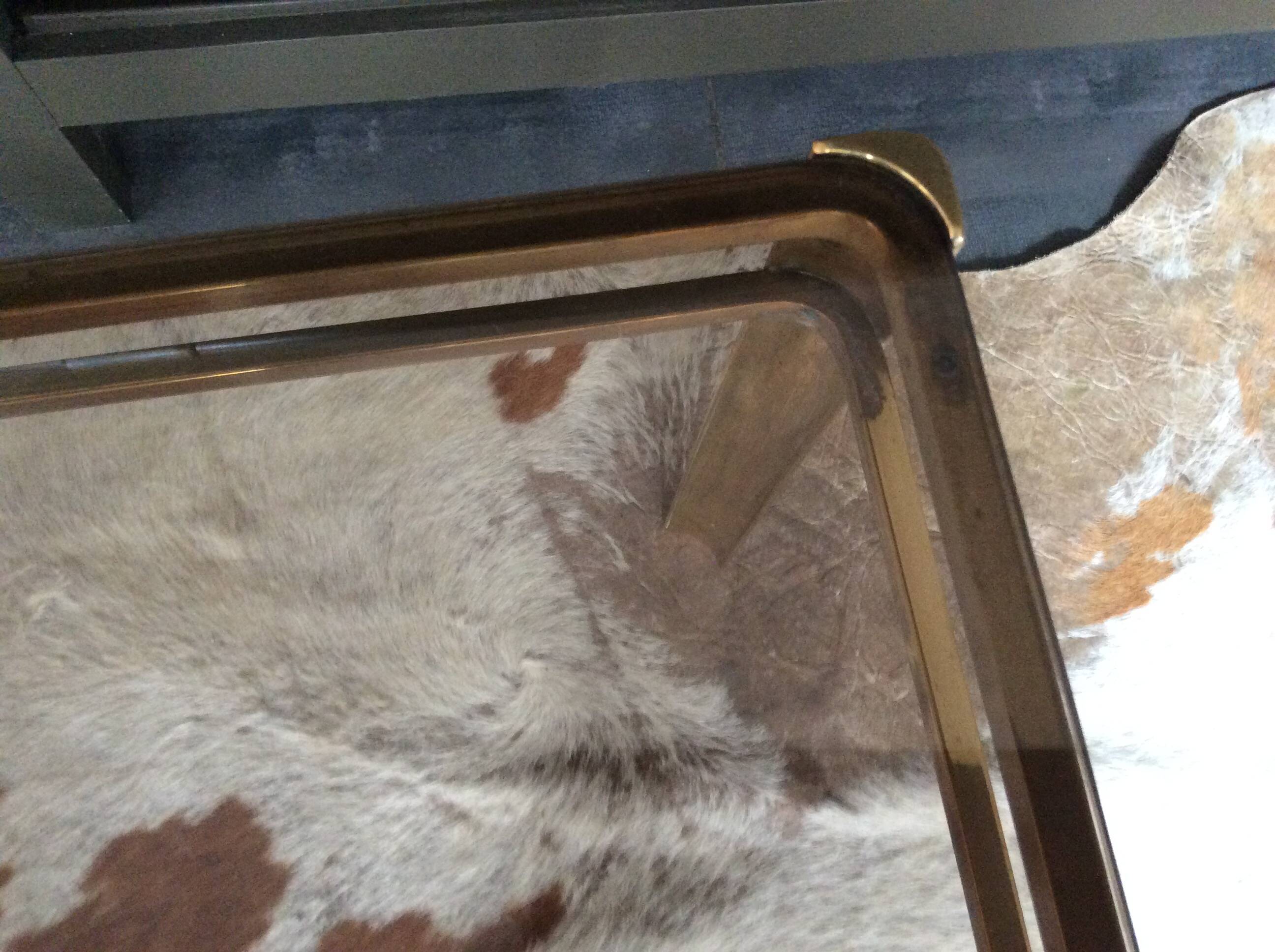 Glass and brass coffee table